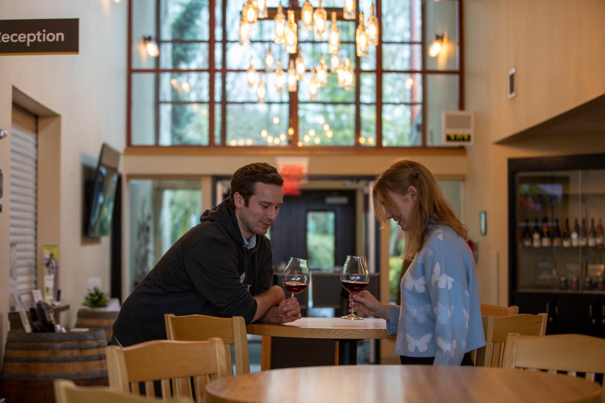 Man and woman drinking wine at an event